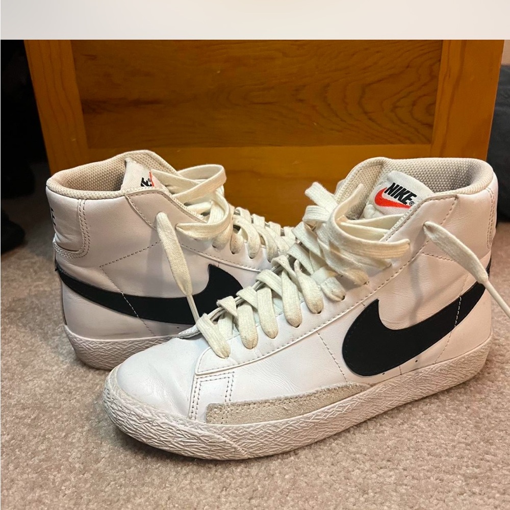 Nike White and Black Sneakers with High-Top Design and Large Swoosh Logo